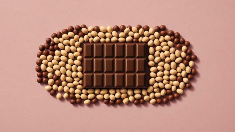 Minimalist illustration of chocolate-covered peanuts with warm lighting symbolizing Chocolate Peanut Day in Australia.
