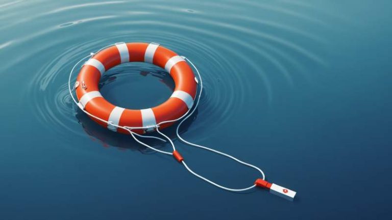 A life buoy floating on calm water with a safety whistle and first aid kit nearby symbolizing drowning prevention in Australia.